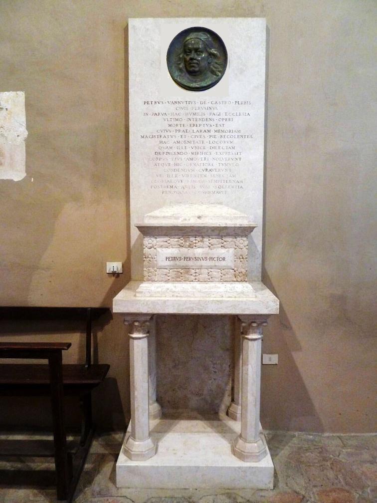 Perugino’s tomb in the Church of the Annunziata in Fontignano, with a commemorative epitaph and a relief portrait.