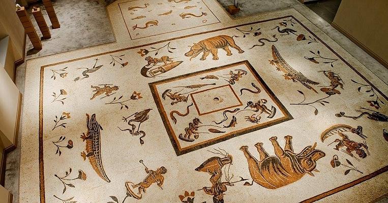 Mosaic floor with Nilotic scenes from the site of Urvinum Hortense, now displayed in a museum.