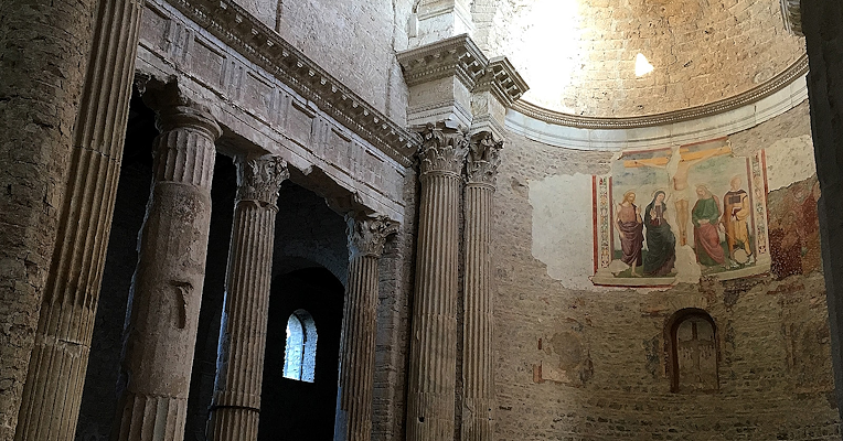Interior of the Basilica of San Salvatore with apse and spolia columns