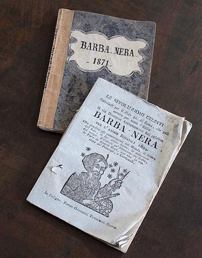Booklet Almanacs with the inscription “Barba-Nera, the first one with the image of Barbanera, the one behind being from 1871