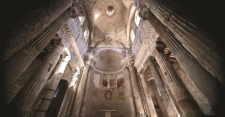 Interior of the Church of San Salvatore with apse and spolia columns